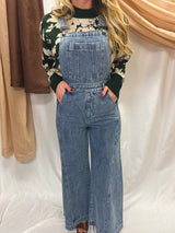 down to the denim overalls